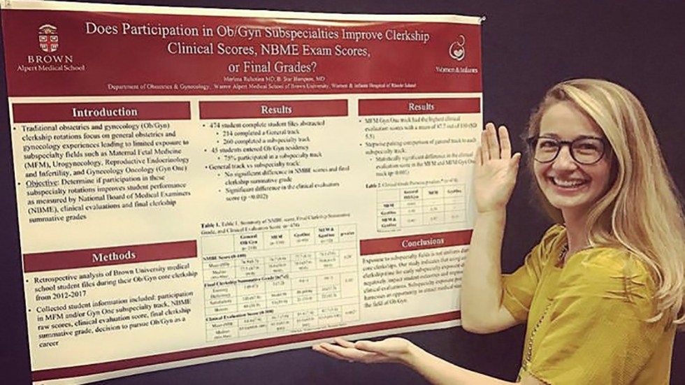 a person posing with an informational poster