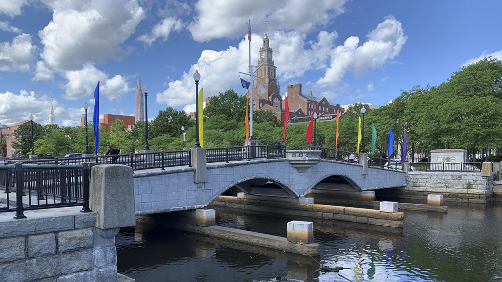 pride flags on a bridge
